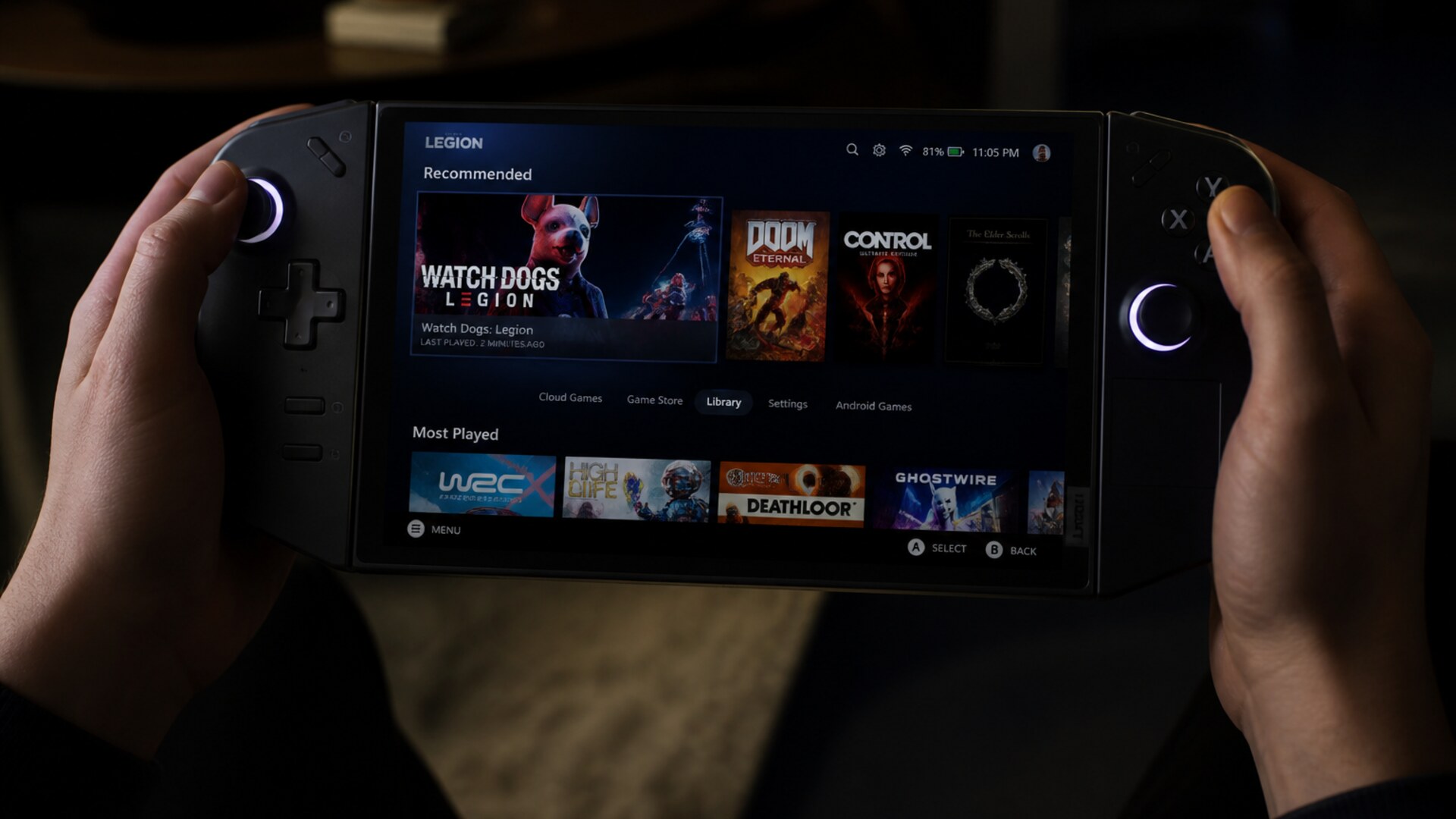 Hands holding a Legion handheld at night
