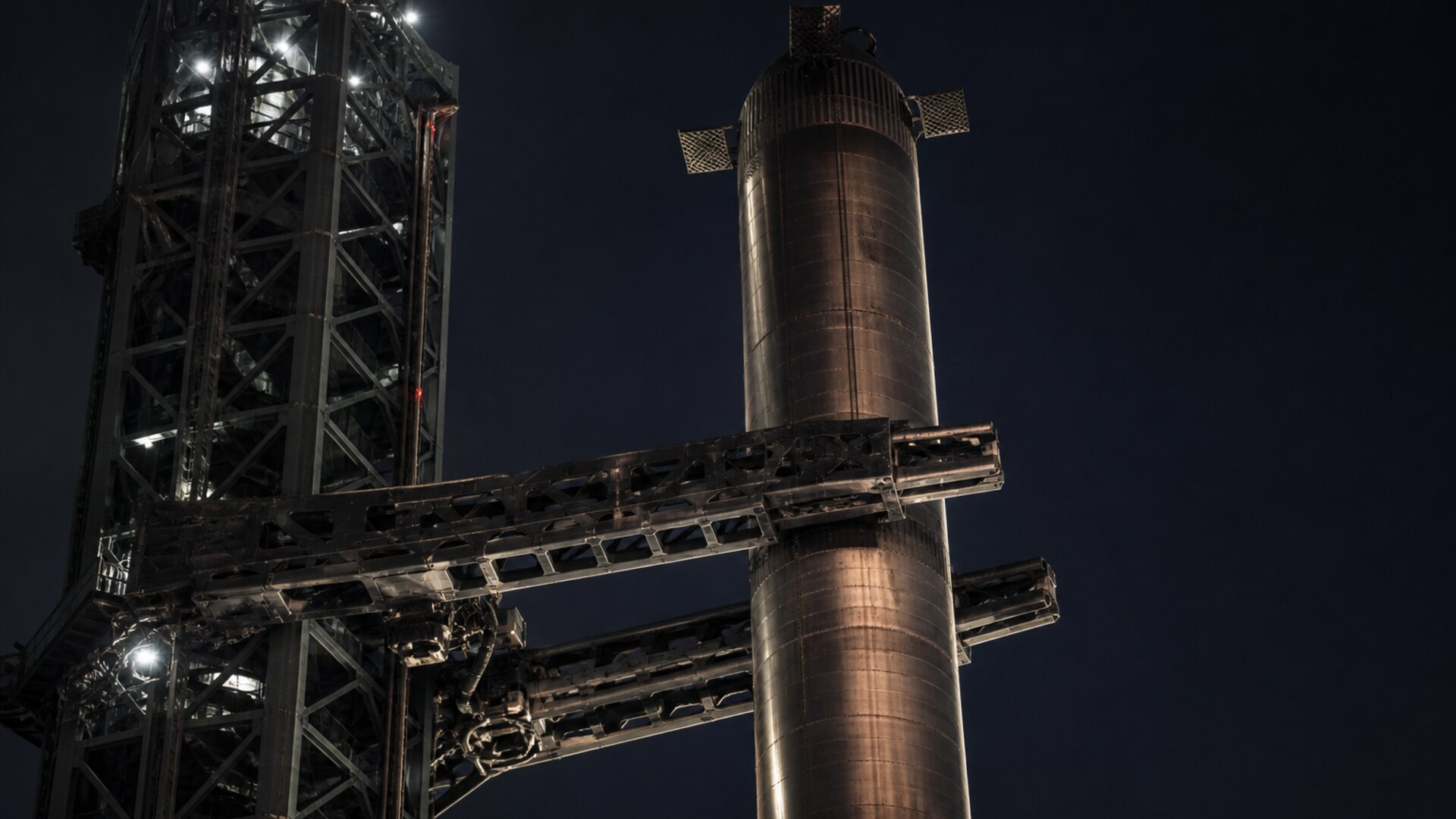 Stainless booster held at night in chopstick arms